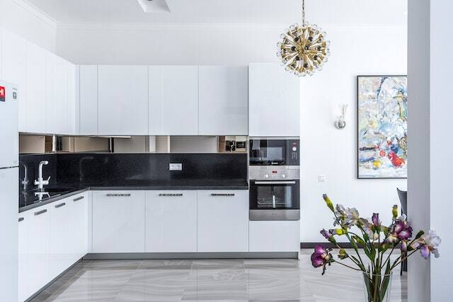 stylish white kitchen interior design with stainless steel appliances